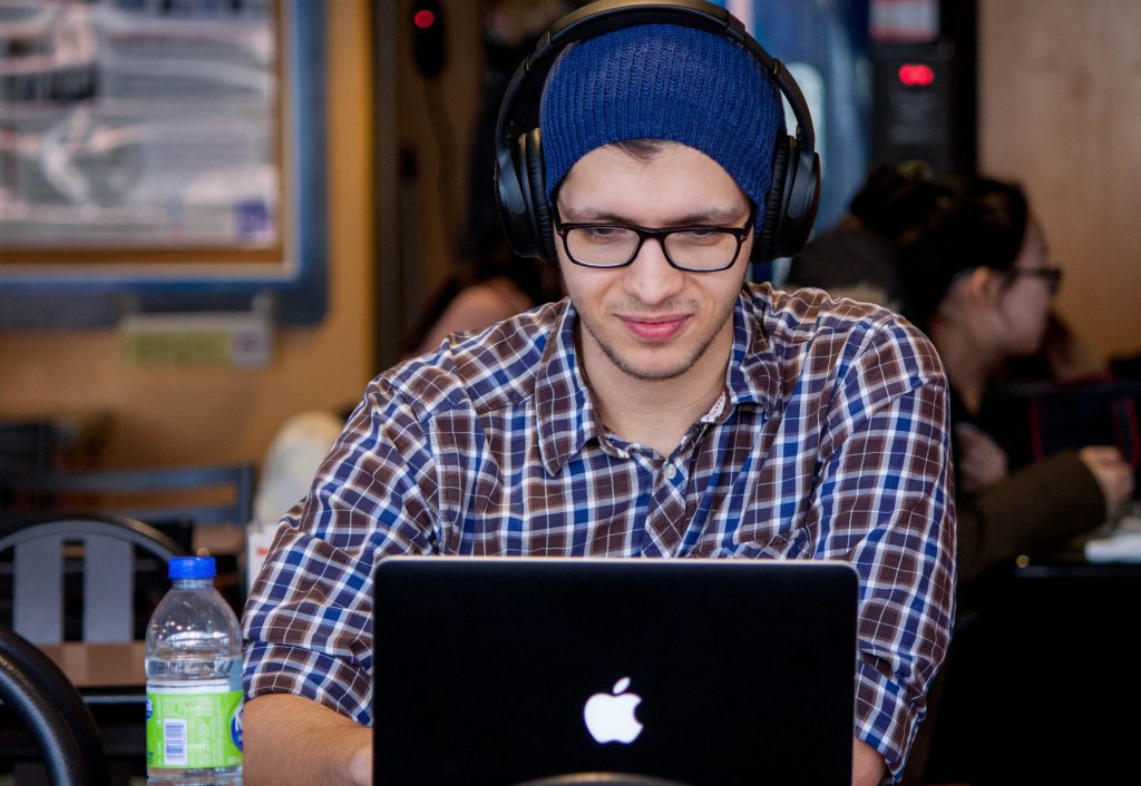 man at laptop wearing glasses