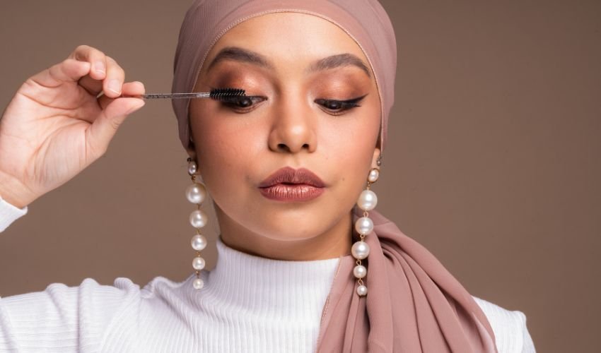 Muslim Woman Putting on Mascara
