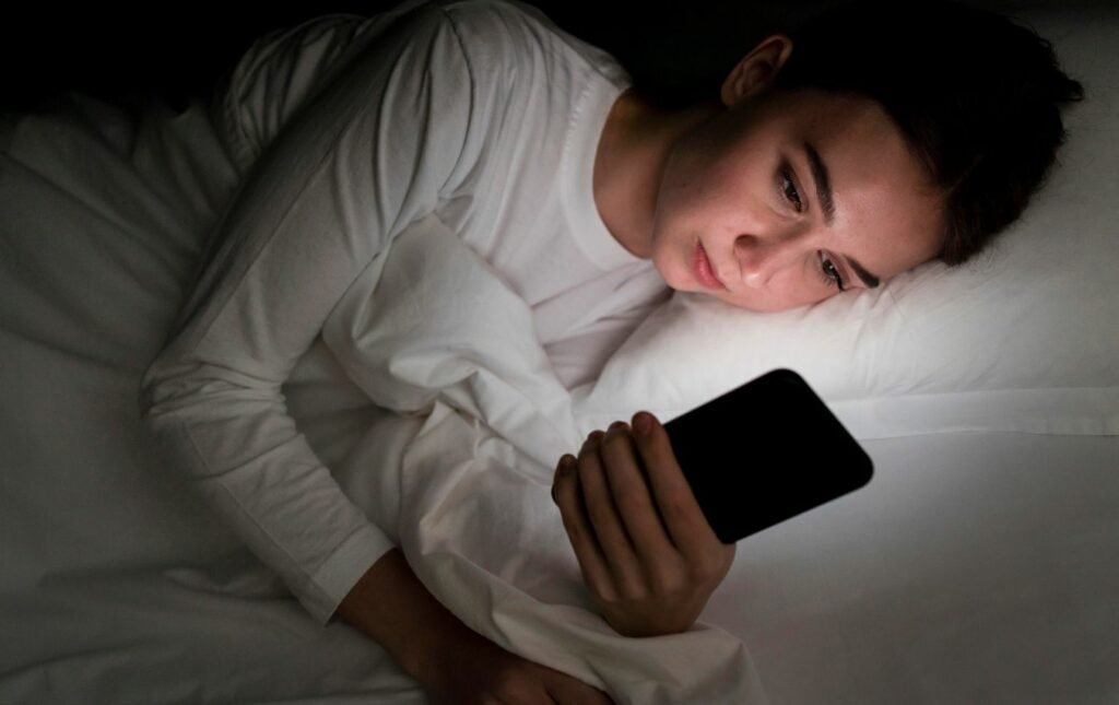 girl in bedroom with phone